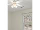 Bright bedroom with ceiling fan and window at 3669 White Sands Way, Suwanee, GA 30024