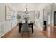 Formal dining room with chandelier and hardwood floors at 3669 White Sands Way, Suwanee, GA 30024