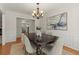 Formal dining room with chandelier and hardwood floors at 3669 White Sands Way, Suwanee, GA 30024