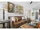 Living room with brown leather couch and gallery wall at 40 Daniel Se St # 6, Atlanta, GA 30312