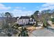 Aerial view of a grand home nestled on a tree-lined lot, offering privacy and curb appeal at 4720 Cliffside Ct, Marietta, GA 30067