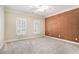 Well-lit bedroom featuring a unique cork accent wall at 4720 Cliffside Ct, Marietta, GA 30067