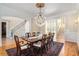 Elegant dining room with hardwood floors, a chandelier, and a large table at 4720 Cliffside Ct, Marietta, GA 30067