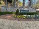 Rivercliff community entrance with a stone wall and manicured landscaping at 4720 Cliffside Ct, Marietta, GA 30067