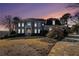 Elegant home exterior at dusk, showcasing curb appeal and landscaping at 4720 Cliffside Ct, Marietta, GA 30067