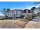 Elegant two-story home with stone pathway and manicured lawn at 4720 Cliffside Ct, Marietta, GA 30067