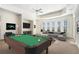 Game room with pool table, sectional sofa, and large windows at 4720 Cliffside Ct, Marietta, GA 30067