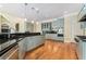 Modern kitchen with light blue cabinets, granite countertops, and stainless steel appliances at 4720 Cliffside Ct, Marietta, GA 30067