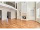 Spacious living room featuring hardwood floors, a fireplace, and built-in shelving at 4720 Cliffside Ct, Marietta, GA 30067