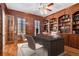 Home office with wood paneling and built-in bookshelves at 4720 Cliffside Ct, Marietta, GA 30067