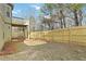 Large backyard with a wooden fence and deck at 654 Ocean Ave, Canton, GA 30114