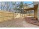 Fenced backyard with a deck and spacious lawn at 654 Ocean Ave, Canton, GA 30114