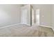 Spacious bedroom with carpeted floors and built-in shelving at 654 Ocean Ave, Canton, GA 30114