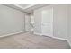 Spacious bedroom with carpeted floors and neutral walls at 654 Ocean Ave, Canton, GA 30114