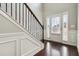 Bright entryway with hardwood floors and elegant staircase at 654 Ocean Ave, Canton, GA 30114