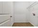 Laundry room with built-in shelving and tile flooring at 654 Ocean Ave, Canton, GA 30114