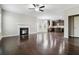 Spacious living room with hardwood floors, fireplace and kitchen view at 654 Ocean Ave, Canton, GA 30114