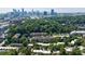 High-rise apartments and surrounding landscape, with a city skyline in the distance at 101 Ardmore Nw Pl # 3, Atlanta, GA 30309