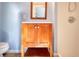 Bathroom featuring a wooden vanity with mirror at 1995 Benson Se Ave, Smyrna, GA 30080