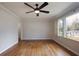 Bright living room featuring gleaming hardwood floors, neutral walls, and large window at 1995 Benson Se Ave, Smyrna, GA 30080