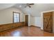 Charming attic bedroom with wood floors and barn door at 5664 Dorsett Shoals Rd, Douglasville, GA 30135