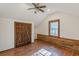 Charming attic bedroom with wood floors, barn door, and window at 5664 Dorsett Shoals Rd, Douglasville, GA 30135