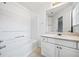 Bathroom with a tub/shower combo and white vanity at 6691 Sunset Hills Blvd, Rex, GA 30273