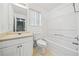 Clean bathroom includes a tub shower and vanity at 6691 Sunset Hills Blvd, Rex, GA 30273