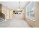 Bright dining room features a chandelier and kitchen views at 6691 Sunset Hills Blvd, Rex, GA 30273