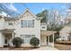 Two-story home features a covered porch and landscaping at 6691 Sunset Hills Blvd, Rex, GA 30273
