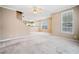 Spacious living room with neutral carpeting and large windows at 6691 Sunset Hills Blvd, Rex, GA 30273