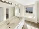 Double vanity bathroom with soaking tub at 1535 Valley Club Dr, Lawrenceville, GA 30044