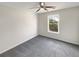 Simple bedroom with gray carpeting and a window at 1535 Valley Club Dr, Lawrenceville, GA 30044