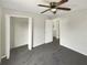 Spacious bedroom with ceiling fan and grey carpet at 1535 Valley Club Dr, Lawrenceville, GA 30044