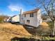 Two-story house with beige siding and a landscaped yard at 1535 Valley Club Dr, Lawrenceville, GA 30044
