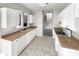 White kitchen with gas range and light brown countertops at 1535 Valley Club Dr, Lawrenceville, GA 30044
