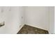 Laundry room with vinyl flooring and overhead shelving at 1535 Valley Club Dr, Lawrenceville, GA 30044