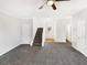 Bright living room featuring gray carpeting and a staircase at 1535 Valley Club Dr, Lawrenceville, GA 30044