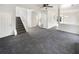 Living room with gray carpeting and staircase at 1535 Valley Club Dr, Lawrenceville, GA 30044