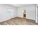 Cozy bedroom with a large window and hardwood floors, featuring a bathroom at 1580 Mary George Nw Ave, Atlanta, GA 30318