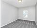 This cozy bedroom features a large window for natural light and neutral carpet at 1580 Mary George Nw Ave, Atlanta, GA 30318