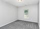 Bedroom featuring neutral colored carpet and a window that allows for lots of natural light at 1580 Mary George Nw Ave, Atlanta, GA 30318