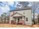 Two-story house with gray siding, a covered front porch, and a well-maintained lawn at 1580 Mary George Nw Ave, Atlanta, GA 30318