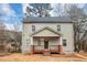 Charming two-story home with a covered front porch and a well-maintained yard at 1580 Mary George Nw Ave, Atlanta, GA 30318