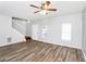 Open-concept living room with hardwood floors and ample natural light at 1580 Mary George Nw Ave, Atlanta, GA 30318