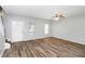 Open living room boasts wood-look flooring, natural light, and a modern ceiling fan at 1580 Mary George Nw Ave, Atlanta, GA 30318