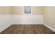 Bright bedroom with neutral walls and wood-look flooring at 4074 Yeager Rd, Douglasville, GA 30135