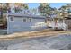 Gray house with a wooden porch and driveway at 4074 Yeager Rd, Douglasville, GA 30135