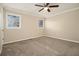 Main bedroom with ceiling fan and neutral carpeting at 4074 Yeager Rd, Douglasville, GA 30135