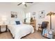 Cozy bedroom with light hardwood floors and a ceiling fan at 437 Great Pine Way, Woodstock, GA 30188